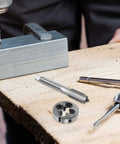 Rock Solid Precision Thread Tap And Die Set With Straight Flute Design For Handheld Convenience And Metal Construction, Perfect For Rapid Thread Repair And DIY Maintenance Tasks That You Can Actually Feel In Your Hands. steel tap and die set for metal thread repair on workbench