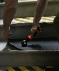 Applying No Slip Grip Tape Roll 12 Inch Wide Self Adhesive Traction Tape With Silicon Carbide Grit on indoor stairs
