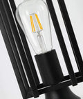 Close-up of light bulb in Outdoor Post Light For Patio And Garden, All Weather Sand Black Metal Lantern, showcasing design details.