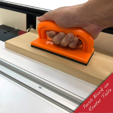 Pro Grade 4 Piece Woodworking Safety Kit push block in use on router table, showing orange handle for table saws and routers