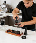 Seven Piece Espresso Tamper Kit Designed For 51mm Filter Cups Portable Coffee Press Tools in use with coffee grounds