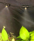 Brass Misting Nozzle Replacement Heads 0.2mm Orifice 10/24 UNC Outdoor Cooling System spraying mist over plants.