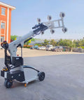 Heavy Duty Mobile Glass Vacuum Lifter With Strong Grip Suction Cups And Wireless Remote For Smooth Construction Work, angled view outdoors.