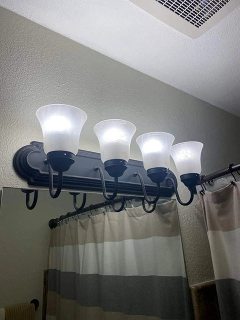 Four bell-shaped frosted milky scavo glass alabaster shades on a wall fixture, ceiling fan light covers, replacement globes