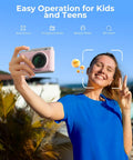 Fire Pink Wifi Digital Camera For Kids Featuring Switchable Dual Lenses And Crisp 4K Capture Point And Shoot Option With Sixteen X Zoom Anti Shake Tech Super Portable Compact Design Prime Gift For Cool Teens held by girl in blue shirt, outdoors, smiling with a peace sign.