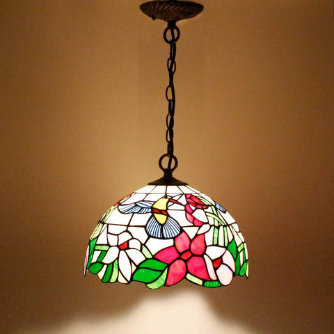 Old School Tiffany Hummingbird Amber Stained Glass Pendant Light Fixture With 12 Inch Wide Shade And 32 Inch Chain Hardwired Hanging Lamp In Antique Green Bronze Finish S101 Series showcasing intricate glass design and soft lighting.