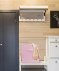 Super Durable Collapsible Storage Cubes 10 5 Inch Foldable Fabric Bins in pink on a shelf next to a towel in a stylish room.