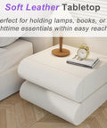 Modern leather upholstered nightstand with roomy desktop space and two wooden drawers for easy storage.