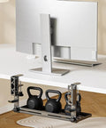 Chill Out The Cord Mess With This Heavy Duty Under Desk Cable Organizer That No Drill Clamps secure on any desk edge, holding kettlebells.