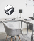 Heavy Duty Silicone Furniture Pads 132 Pack Non Slip Rubber Leg Protectors with Tack under chair legs on a modern desk.