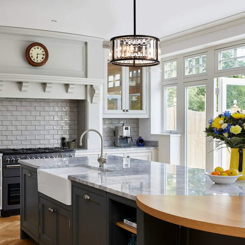 Crystal Drum Pendant Light Fixture With 3 Lights In Black Finish Adjustable Height Cylinder Pendant Lights For Kitchen Island Dining Room Living Room Foyer Hallway Convertible Between Pendant And Semi Flush Mount hanging over a modern kitchen island.