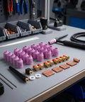 Grab This Awesome 58-Piece Luwecf TIG Consumables Kit For Your Torch That Includes gas lens collet bodies and alumina nozzles on a workbench.