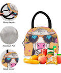 Insulated lunch bag with cow print and sunglasses design, aluminum foil lining, strong handle, and handy pocket, shown with fruits and snacks.