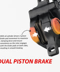 Side view of black hydraulic disc brake caliper showing dual-piston design and exposed brake pads.