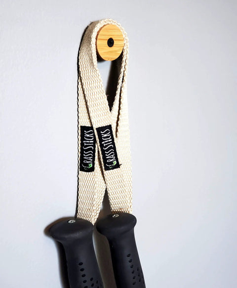 Keep Your Winter Setup Clean With These Sick Bamboo Flush Ski Wall Mount And Snowboard Rack Solutions Solid Space Saving Storage That Holds Boards Flat Against The Wall While You Rip, showing bamboo rack with straps.