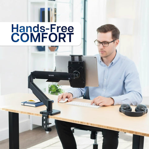 Level Up Your Workspace With This Height Adjustable Counterbalance Desk Mount For Tablets And 15 6 Inch Two In One Laptops Slick Spring Loaded Arm Rock Solid Grip Smooth Glide Finish Black, shown holding a tablet.