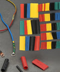 Heat Shrink Tubing Kit Flexible Insulation Sleeves For Wire And Cable Repair Electrical Waterproof Automotive And Home Use 2 Pack Mix Bagged Ideal For DIY Projects And Pro Electrical Work showing assorted colorful tubes arranged with wires on grey surface.