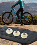 95RX Ebike Gear Set Replacement Parts 40T And 18T Nylon Gears on table with electric bike and scenic background.