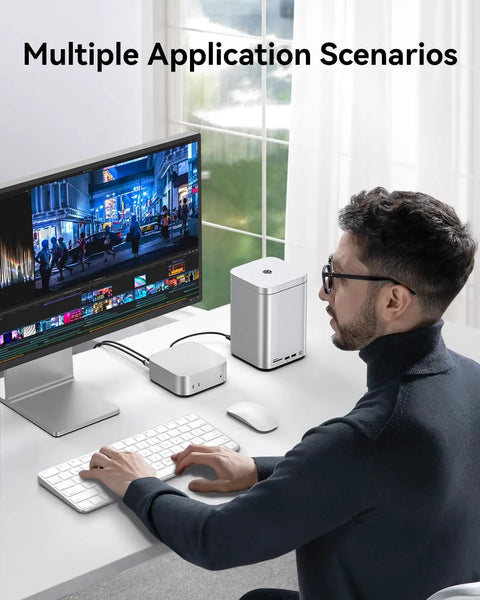 User operating a computer with a Dual Bay Raid Enclosure Packing Lightning Fast Ten Gigabit Speed To Crush Up To Fifty Six Terabytes on desk.