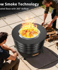 Two people setting up 26 Point 5 Inch Smokeless Fire Pit With Stand For Outdoor Hangouts, bonfire lit, stainless steel, backyard