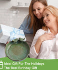 Woman holding green ceramic bird bath, ideal gift for garden, lawn, balcony, deck, or tabletop use, easy to install and clean
