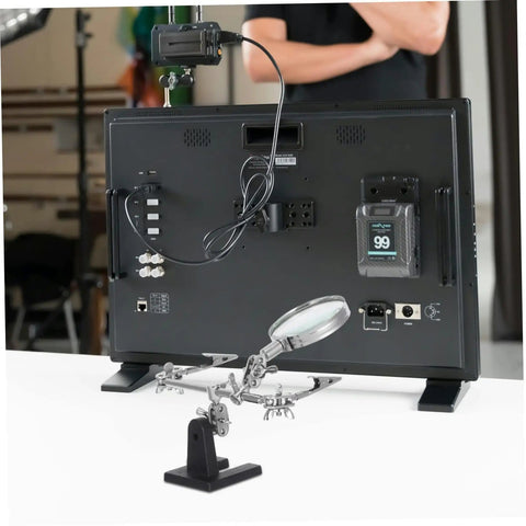 Adjustable Third Hand Soldering Station With Magnifying Glass And Dual Alligator Clips in front of electronic equipment