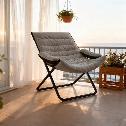 Three Position Adjustable Folding Recliner Chair With Ottoman And Armrests For A Comfy Portable Lounge In Gray on balcony