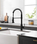 Slick Black Kitchen Faucet With Pull Down Sprayer, Hella Durable 304 Stainless Steel Construction installed in modern kitchen.