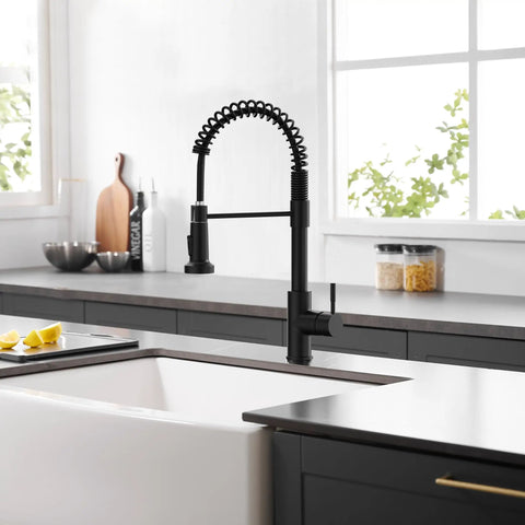 Slick Black Kitchen Faucet With Pull Down Sprayer, Hella Durable 304 Stainless Steel Construction installed in modern kitchen.