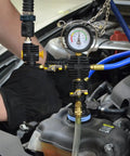 Universal Radiator Pressure Tester And Vacuum Cooling System Kit For Domestic And Import Vehicles With Vacuum Purge And Refill Tool DIY Friendly Fits Nearly All Radiator Openings Color Coded Test Caps In Blow Molded Case. pressure gauge on radiator neck