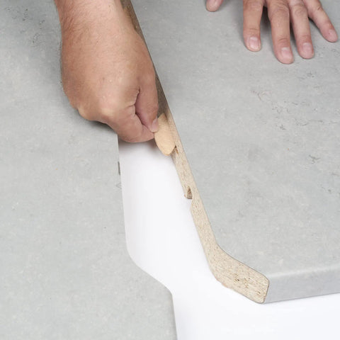 Hand inserting Beechwood Joining Biscuits Variety Pack No 0 10 20 in wood panel for strong joint