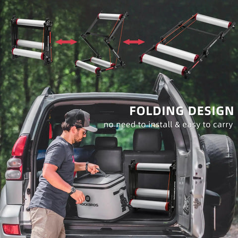 Indoor Bike Roller Trainer With Parabolic Rollers Ride Ready Adjustable Foldable Aluminum Stand shown folded in a car trunk