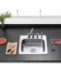 Gourmetier Studio Self Rimming Single Bowl Kitchen Sink GKTS25228 in brushed stainless steel installed on dark countertop