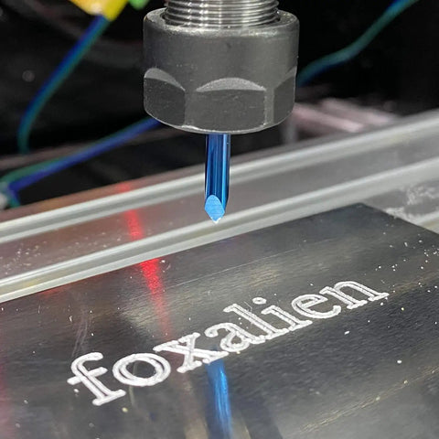 Triangular CNC Router Bit Set 0.1mm V-Bits With Nano Blue Coating And Sharp Pyramid Tips, 1/8 Inch Shank in use on metal surface