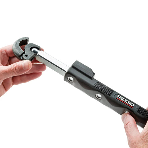 Hands adjusting Telescoping Basin Wrench With LED Light, 10 To 17 Inch Adjustable Under-Sink Tool with black finish and contoured grip