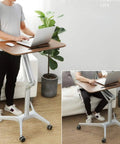 Rolling Laptop Desk With Adjustable Height Stand Ergonomic Portable Workstation For Home Office Gaming Setup, person using mobile desk.