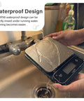 Chef Grade Precision Digital Food Scale With 0.01 Oz And 1 G Readout Waterproof Kitchen Scale being rinsed under a tap