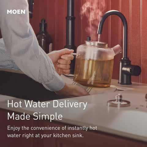 Moen Instant Hot SIP Faucet with Insulated Spout, Spot Resist Stainless, 2-Step Activation and Hands-Free Filling, Requires Tank (Sold Separately), IH7620SRS dispensing hot water into a glass kettle.