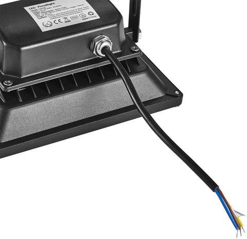Close-up of JUDYSSY Led Flood Lights 20W, 3000K Warm White Led Floodlight Outside, showing wiring and metal casing.