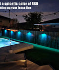 Solar Fence Lights 8 Pack IP65 Waterproof Outdoor RGB Color Lights With 10 Colors And 5 Modes on backyard fence at night
