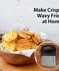 Front view of a black potato cutter with stainless steel wavy blade; crinkle-cut fries in a wooden bowl, inset shows blade.