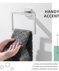 Simple Hand Towel Holder In Brushed Nickel Made From SUS 304 Stainless Steel Square Bathroom Towel Ring For Wall Mount 7.09 Inches With Modern Square Design And Durable Build Great For Hand Towels Face Towels Wash Cloths And More Everyday Must Have shown with dark towel draped over.