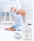 Smooth Swap Replacement Baby Bottle Nipple Ring Collars For Philips Avent Natural And Glass Bottles, Bulletproof Bpa Free Screw Rings, Totally No Sweat Feeding Gear, Six Pack with baby drinking from bottle.