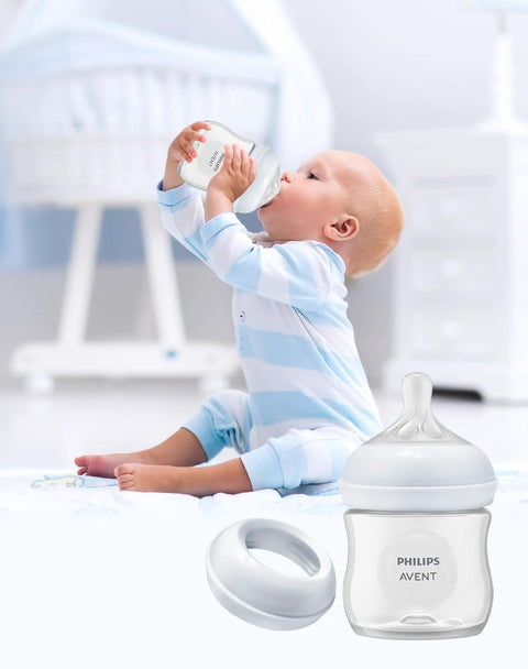 Smooth Swap Replacement Baby Bottle Nipple Ring Collars For Philips Avent Natural And Glass Bottles, Bulletproof Bpa Free Screw Rings, Totally No Sweat Feeding Gear, Six Pack with baby drinking from bottle.