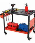 Built Like A Tank Portable Welding Table 36 X 24 Inch Heavy Duty Steel Workbench with tools and accessories on top.