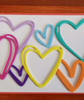 Love Hearts Metal Die Cuts Frame Set 4 Pieces in various colors on display