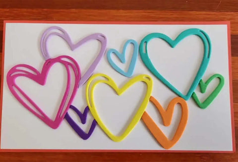 Love Hearts Metal Die Cuts Frame Set 4 Pieces in various colors on display
