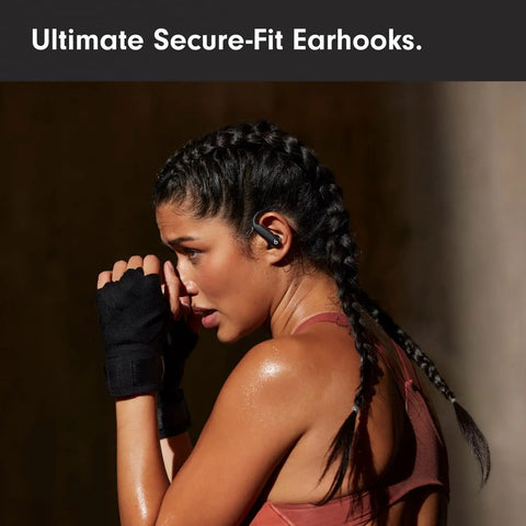 Woman wearing Powerbeats Pro 2 Wireless Noise Canceling Workout Earbuds With Secure Fit Earhooks For Your Gym Grind in Jet Black.