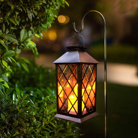 Flickering Lantern With 3 Flameless Candles hanging in garden, showcasing waterproof PVC design and realistic dancing flame effect.