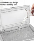 Pouring water into the top water supply of a portable evaporative cooler to maintain functionality.